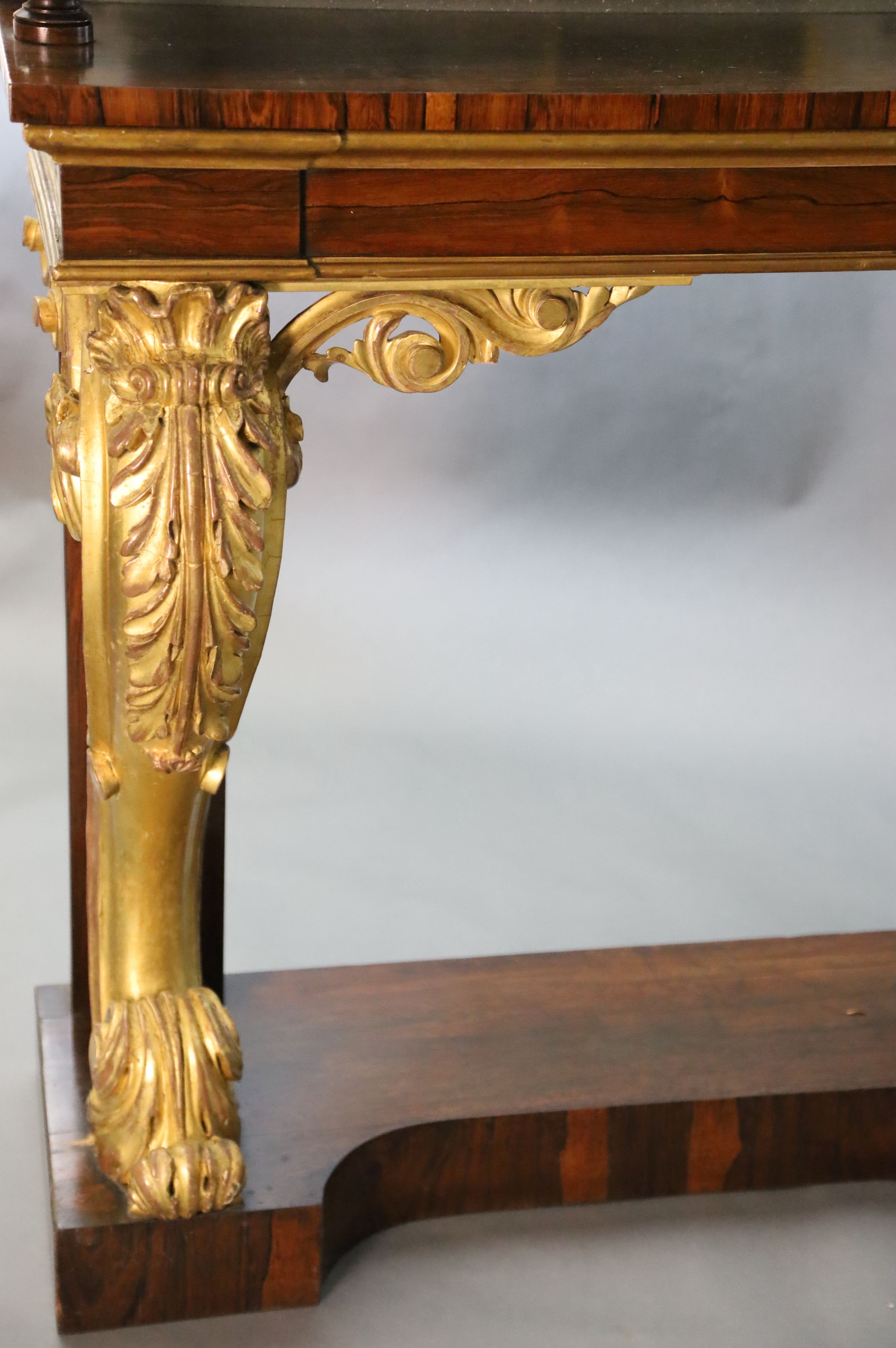 A pair of William IV parcel gilt rosewood console tables, W.8ft 2in. D.1ft 4in. H.4ft 4in.